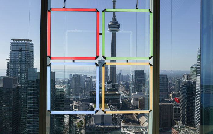 Photo of Microsoft logo with CN Tower in background.