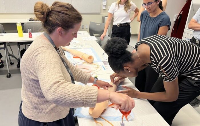 Student practicing IV